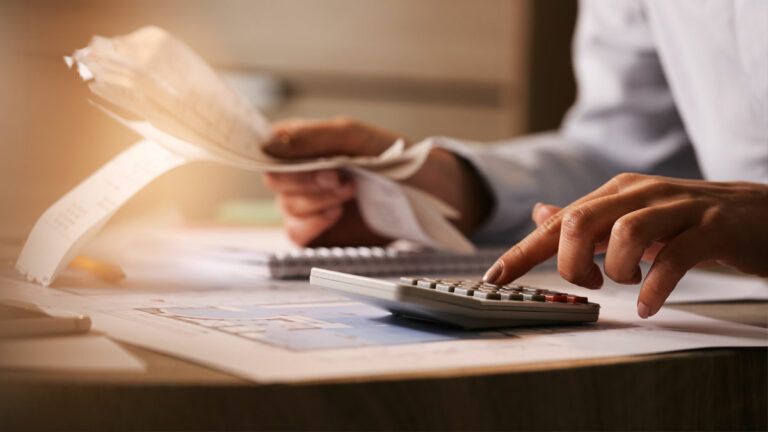 Understanding Legal Costs - Picture of a person budgeting for a lawyer