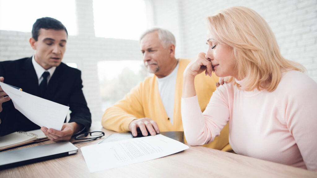 Unopposed Divorces in South Africa - picture of husband and wife with lawyer discussing divorce.